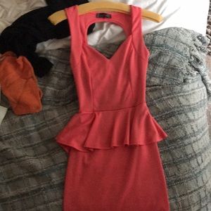 Coral bodycon peplum dress w/open back